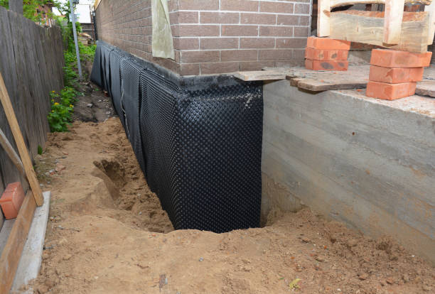 Happy homeowners after waterproofing job in Mineola